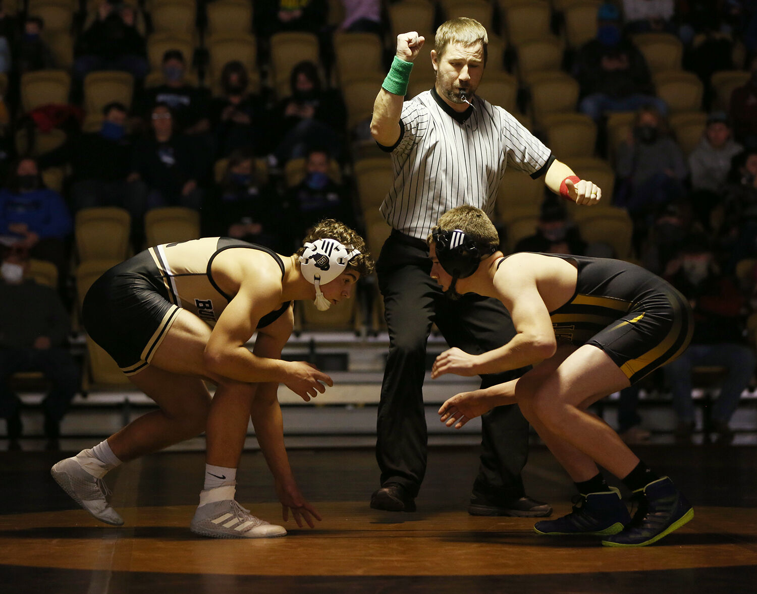 Hazen Camino lines up against Wright opponent Tadlee Isenberger before the start of their match
